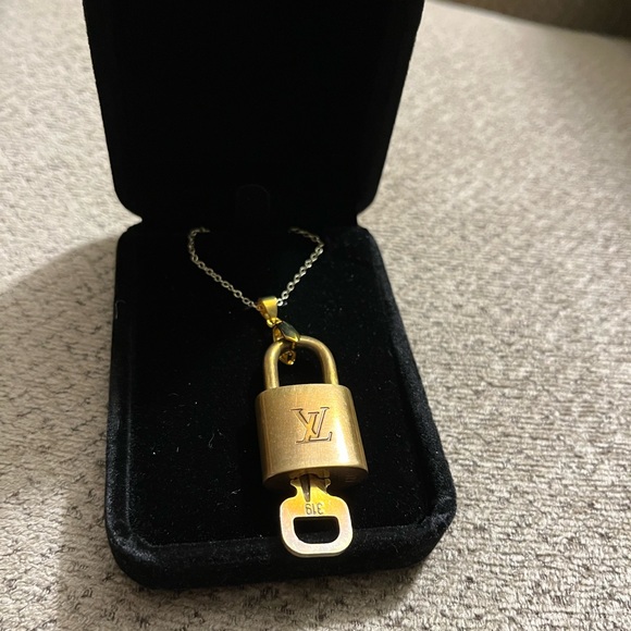 Louis Vuitton Jewelry - Louis Vuitton lock and key necklace. 18” long. Lock number 319.